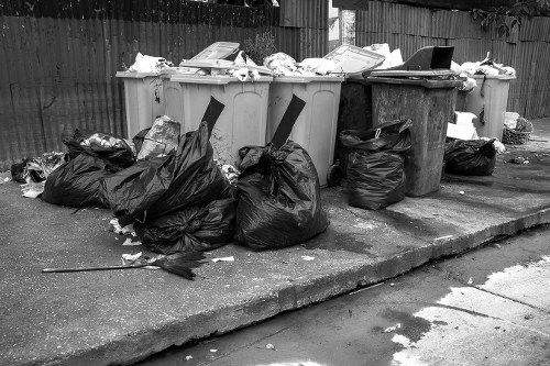 Construction site with waste being cleared in Leyton