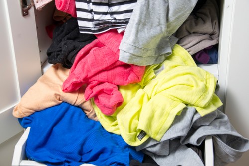 Sealed waste bags being loaded into a licensed vehicle